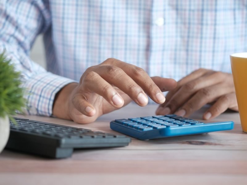 Accountant using a calculator at a desk